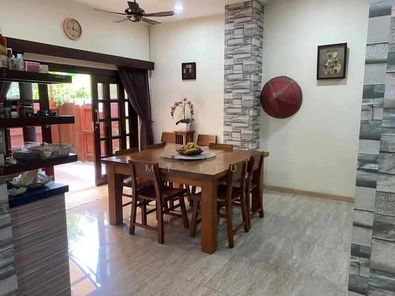 Dining features: wooden dining table with 8 chairs, pendant light fixture, sliding glass door leading to outdoor area, cream painted walls, grey stone accent wall, wall-mounted artwork, decorative round wall piece, tile flooring, ceiling fan, open shelving with kitchen items; style: modern; view: garden.