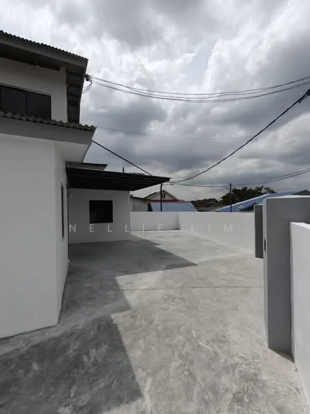 Exterior features: flat concrete flooring, white painted walls, overhang roof, power lines visible, cloudy sky, surrounding rooftops; style: modern.