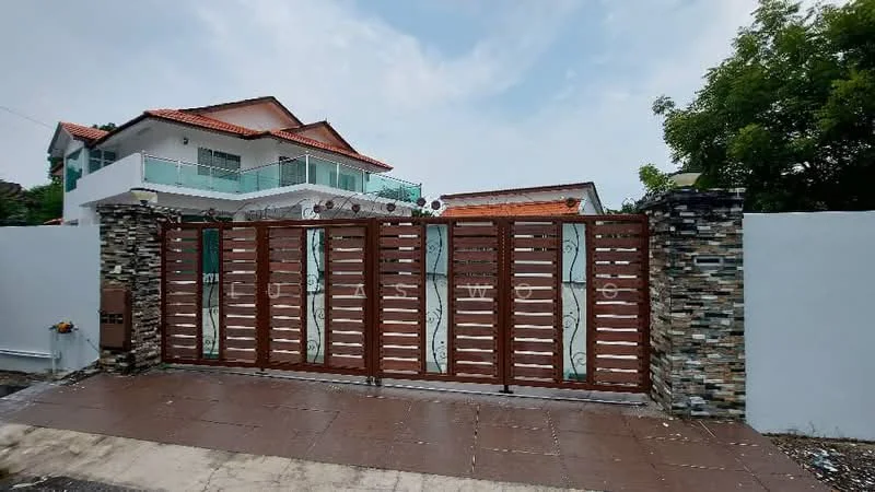 Exterior type: detached bungalow; features: wooden gate with horizontal slats, stone-clad wall, white painted wall, paved driveway, landscaped garden, two-storey house in background, red tiled roof, balcony on upper floor; style: modern.
