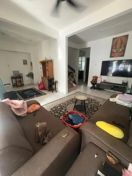 Living features: 3-seater fabric sofa in brown, area rug with geometric pattern, wall-mounted TV, TV console, coffee table, ceiling fan, white painted walls, tile flooring, decorative wall art, potted plants, staircase visible in background, open layout to adjacent room; style: contemporary.