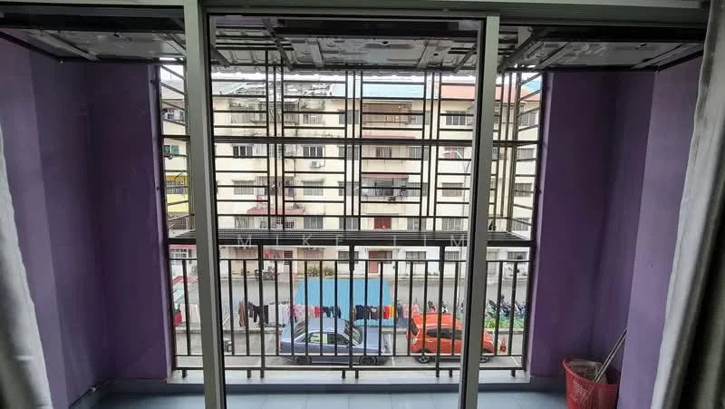 Room features: purple painted walls, sliding glass door, floor-to-ceiling windows, metal railing, tile flooring, curtains, view of adjacent building, view of street, visible vehicles outside; view: city.