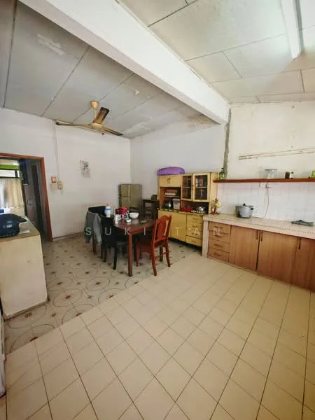 Kitchen features: tile flooring, white painted walls, exposed ceiling beams, ceiling fan, wooden cabinetry, countertop with sink, dining table with chairs, refrigerator, kitchen appliances on countertop, open layout, window for natural light; style: traditional.