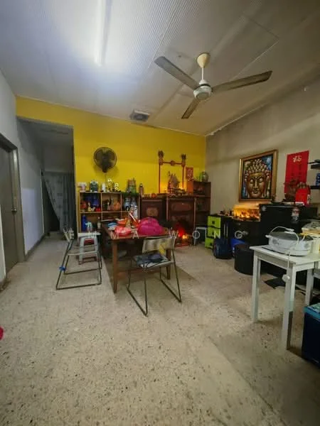 Room features: yellow painted walls, exposed ceiling, ceiling fan, table with chairs, decorative wall art, wooden cabinets, various decorative items, flooring with speckled pattern, storage boxes, open layout; style: traditional.