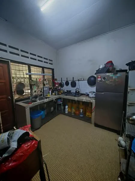Kitchen features: stainless-steel fridge, kitchen countertop, wall-mounted cabinets, open shelving, ceramic tile flooring, sink, multiple cooking pots, kitchen utensils, window with metal grilles, light fixture on ceiling.