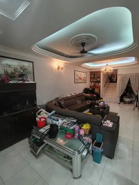 Living features: cream painted walls, tray ceiling with decorative moulding, 5-blade ceiling fan with light, marble tile flooring, 3-seater fabric sofa in grey, glass coffee table, decorative wall art, chandelier, curtains, built-in cabinetry, various items on surfaces; style: modern.