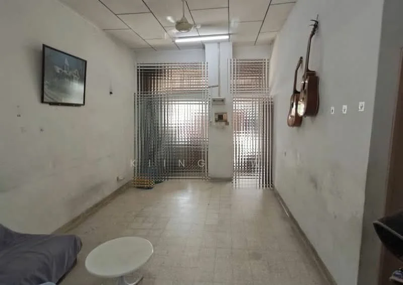 Room features: white painted walls, tile flooring, ceiling lights, security grille, window with blinds, guitar mounted on wall, framed artwork, sofa, coffee table; style: minimalist.