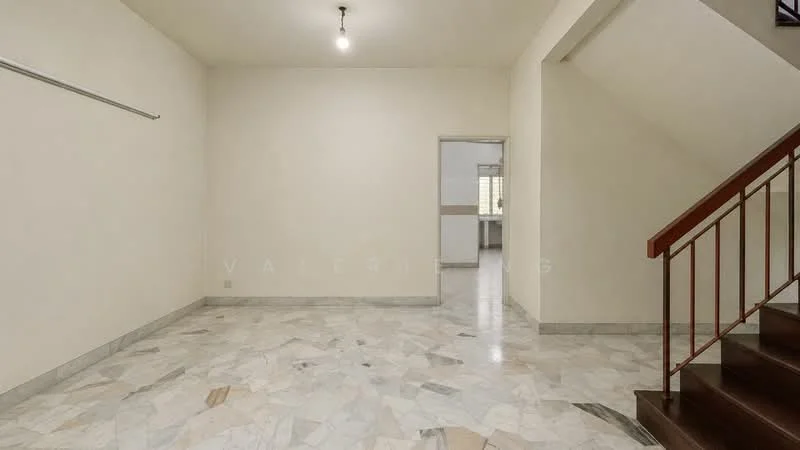 Room features: marble flooring, white painted walls, single light bulb fixture, staircase with wooden railing, open space layout, window with natural light, doorway leading to another room; style: minimalist.