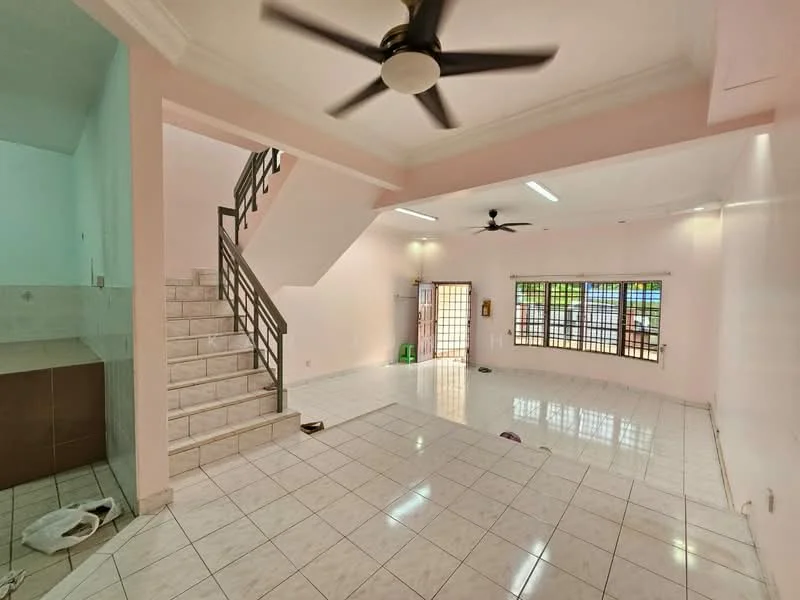Living features: white tiled flooring, pink painted walls, ceiling fan with 5 blades, large windows with security bars, staircase with metal railing, open layout, natural light from windows, no visible furniture; style: modern. Kitchen features: white tiled flooring, brown cabinetry, open layout to living area; style: modern.