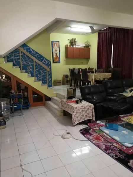 Living features: black leather sectional sofa, coffee table, area rug with floral pattern, white tiled flooring, green painted walls, decorative wall art, curtains in dark red, staircase with blue patterned risers, dining area with wooden dining table and chairs, wall-mounted shelving unit, decorative plants on shelves; style: contemporary.