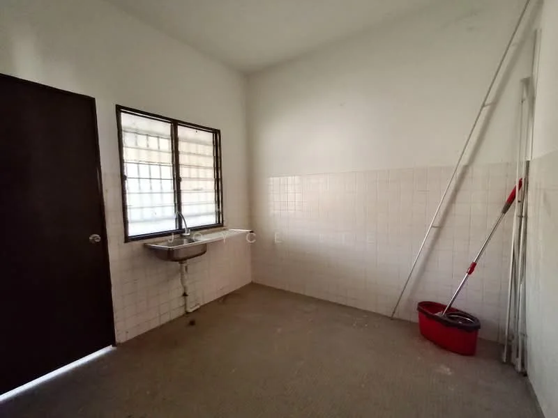 Laundry features: white tiled walls, grey tiled flooring, single-bowl stainless-steel sink, window with grid pattern, mop and bucket, cleaning supplies, empty space, light fixture on ceiling.
