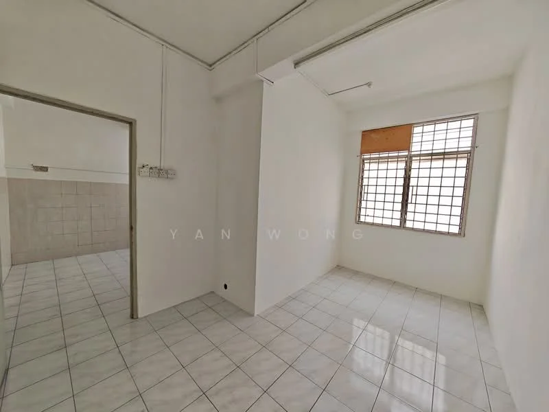 Room features: white painted walls, white tiled flooring, single window with grid pattern, natural light from window, plain ceiling, no visible furniture, neutral color scheme, corner of room visible; style: minimalist.