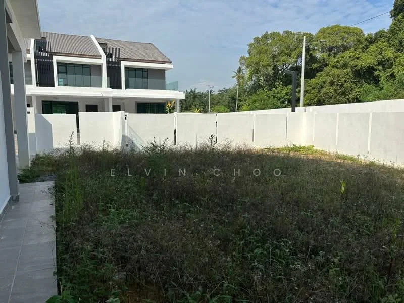 Exterior features: fenced yard, overgrown grass, concrete wall, clear sky, surrounding greenery, paved walkway; style: modern.