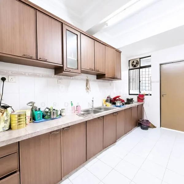 Kitchen features: brown wooden cabinetry, double-bowl stainless-steel sink, chrome pull-down faucet, laminate countertop, white tiled backsplash, white tiled flooring, wall-mounted air conditioning unit, window with security grille, various kitchen utensils and containers, cleaning supplies, door leading to outside, overhead cabinets; style: modern.