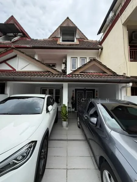 Exterior type: linked terrace house; features: pitched tile roof, white painted facade, two-storey structure, manicured driveway, paved parking area, front porch with railing, window shutters, decorative gable, planter with greenery, visible car parking; style: modern.