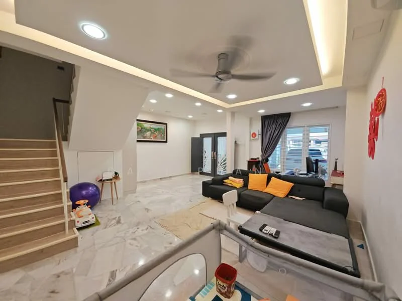 Living features: marble flooring, 5-blade ceiling fan with light, sofa in dark grey, orange throw pillows, white coffee table, decorative wall art, large windows with sheer curtains, wall-mounted TV, area rug, staircase with wooden steps, wall-mounted decorative items, light fixtures in ceiling; style: modern.