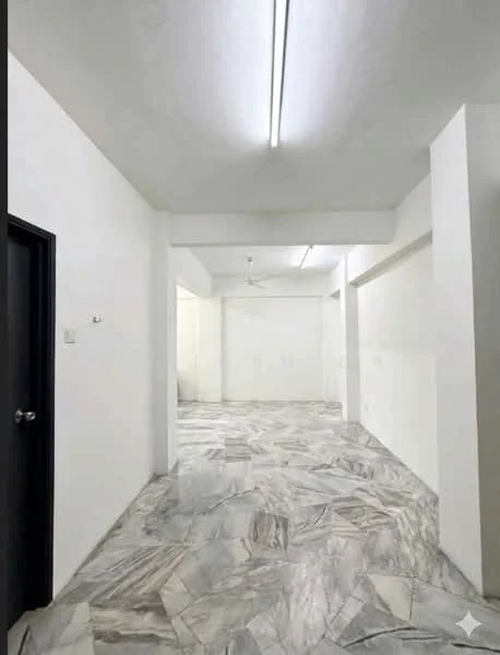 Room features: white painted walls, marble flooring, ceiling with fluorescent lighting, ceiling fan, open layout, no visible furniture, neutral color scheme, large space; style: minimalist.