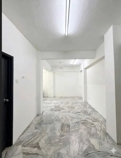 Room features: white painted walls, marble flooring, ceiling with fluorescent lighting, ceiling fan, open layout, no visible furniture, large open space, neutral color scheme; style: minimalist.
