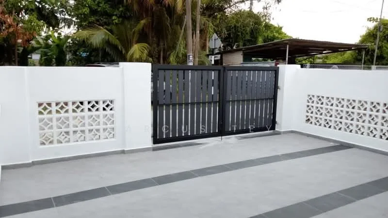 Exterior features: white painted walls, grey tiled flooring, black metal gate, decorative lattice wall, paved driveway, surrounded by greenery, carport structure, tropical landscaping; style: modern.