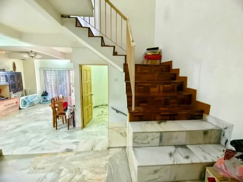 Room features: marble flooring, wooden staircase, white painted walls, natural light from windows, open layout, dining area visible, staircase with wooden railing, decorative wall features; style: modern.