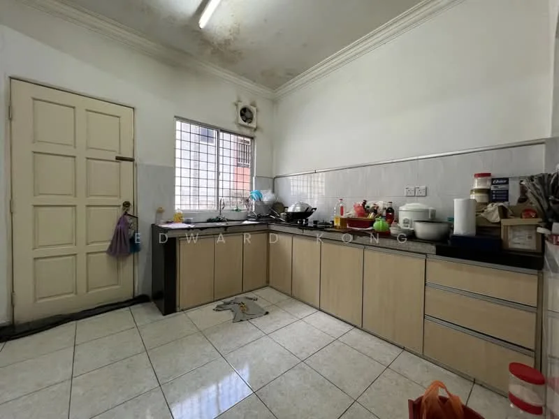 Kitchen features: L-shaped kitchen layout, cream cabinetry, black countertop, stainless-steel sink, chrome faucet, ceramic tile flooring, white tiled walls, window with metal grille, built-in stove, microwave, refrigerator, various kitchen utensils and appliances.