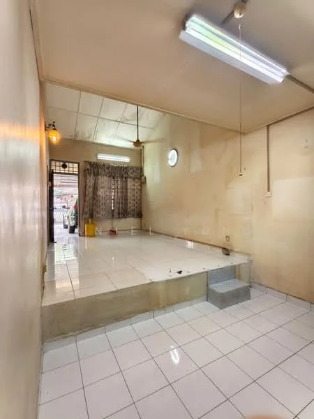Room features: white painted walls, glossy white tile flooring, ceiling with fluorescent lights, round window, curtains with floral pattern, raised platform area, steps leading up to platform, wall-mounted fan; style: minimalist.