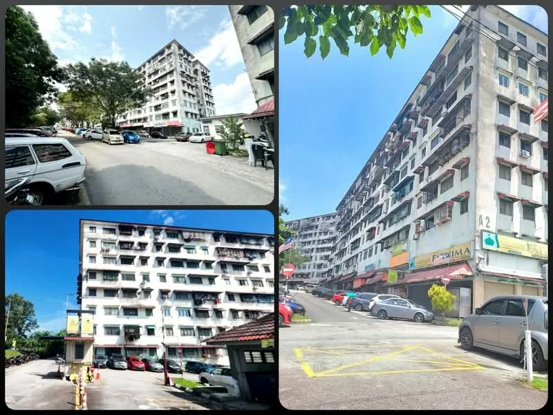 Exterior type: low-rise apartment block; features: white painted facade, multiple storeys, balconies visible on upper floors, parking area with marked spaces, surrounded by trees, street view with cars parked, commercial units on ground floor, signage visible on building, open-air parking lot, entrance with access road; style: modern.
