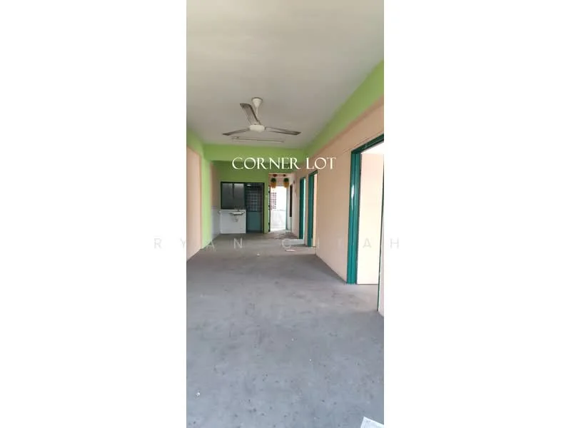 Room features: grey concrete flooring, green painted walls, white painted walls, ceiling fan, multiple doorways, open layout, natural light from doorways.