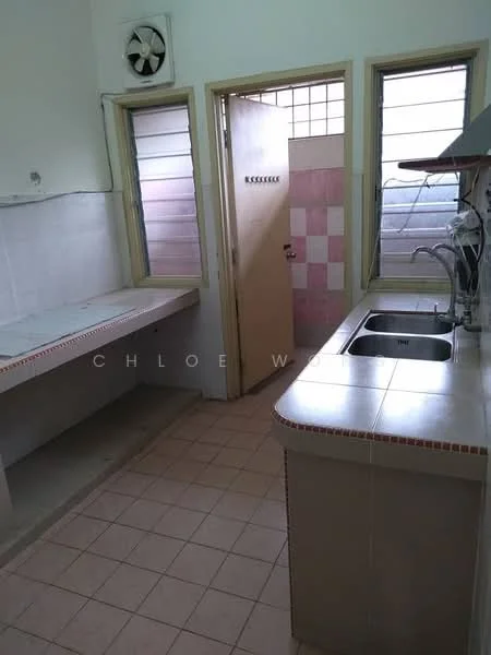 Kitchen features: single-bowl stainless-steel sink, chrome pull-down faucet, countertop with tiled edge, built-in cabinetry, wall-mounted exhaust fan, tile flooring, window with horizontal slats, door with window panel, light-colored walls, pink accent tiles.