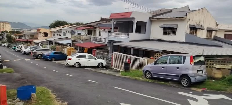 Exterior type: linked terrace house; features: two-storey linked terrace houses, flat roof, cream painted facade, red awnings, balconies on upper floors, driveways for parking, manicured grass area, street view with parked cars, surrounded by residential area, urban context with nearby buildings; style: modern.