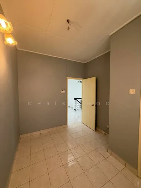 Room features: grey painted walls, white ceiling, tile flooring, single light fixture with three bulbs, doorway leading to another room.