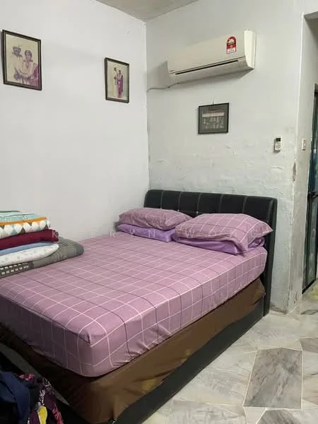 Bedroom features: queen-size bed with black leather headboard, purple checkered bedspread, two purple pillows, white painted walls, air conditioning unit on wall, framed artwork on walls, tile flooring with a mix of colors, built-in wardrobe visible through door.