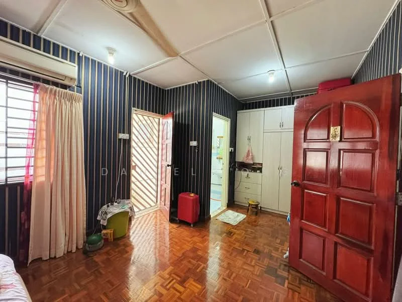 Room features: wooden flooring, striped wallpaper in dark blue and cream, white ceiling with recessed lights, 1 wall-mounted split AC, window with metal grille, red wooden door, white curtains, built-in wardrobe with white doors, door leading to bathroom, small red storage box, green storage container; style: traditional.