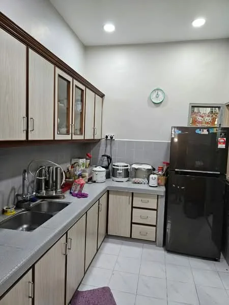Kitchen features: grey laminate countertop, light wood cabinetry with glass-front upper cabinets, stainless-steel single-bowl sink, chrome pull-down faucet, black fridge, white rice cooker, white electric kettle, white blender, microwave, ceramic tile flooring, recessed LED downlights, wall clock, purple kitchen mat; style: modern.