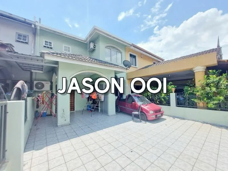 Exterior type: linked terrace house; features: paved driveway, car porch, two-storey building, green exterior wall, brown tiled roof, front garden area with plants, satellite dish, air conditioning units, windows with grills, open space in front; style: modern.