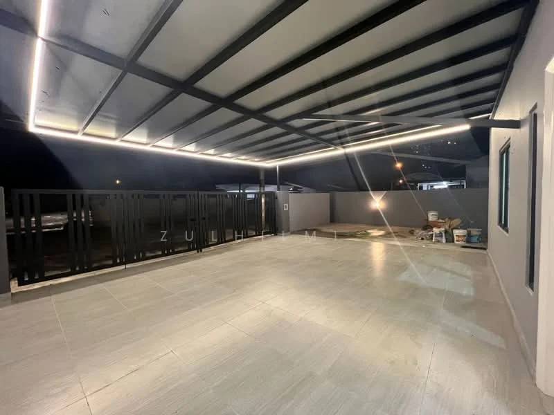 Exterior features: covered patio with metal roof, grey tiled flooring, black metal railing, outdoor lighting, concrete wall, open space, landscaped area, nighttime view; style: modern.