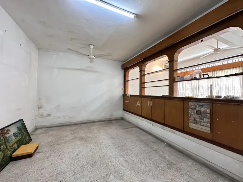 Room features: white painted walls, concrete flooring, ceiling fan, wooden counter, glass partition, built-in shelving, fluorescent lighting.