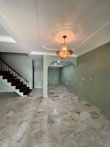 Room features: marble flooring, green painted walls, tray ceiling, chandelier, staircase with wooden railing, arched entryway, crown moulding, natural light from windows; style: modern.