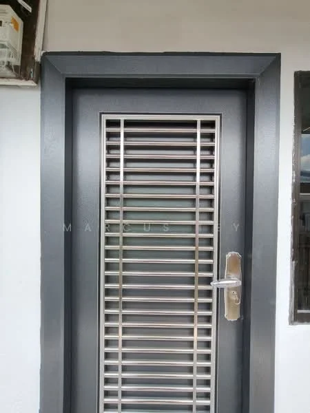 Exterior features: metal door with horizontal slats, silver door handle, grey door frame, white wall surrounding the door, small window beside the door; style: modern.