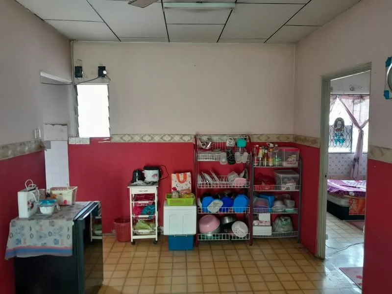 Room features: pink painted walls, cream painted walls, tile flooring, ceiling fan, window with security bars, shelving unit with various containers, small cart with kitchen items, table with tablecloth, doorway leading to another room; style: traditional.