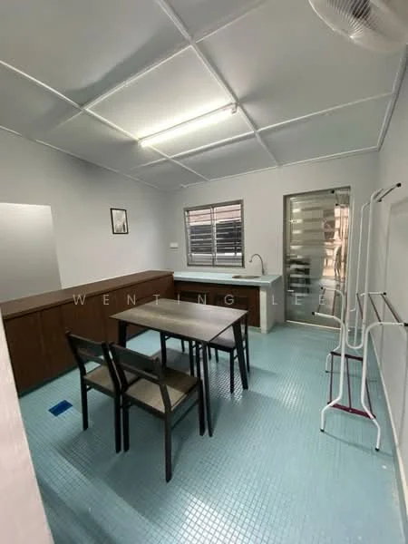 Room features: grey painted walls, blue tile flooring, ceiling with fluorescent lighting, window with horizontal blinds, single-bowl stainless-steel sink, chrome pull-down faucet, wooden cabinetry, dining table with four chairs, sliding glass door, clothes drying rack; style: modern.