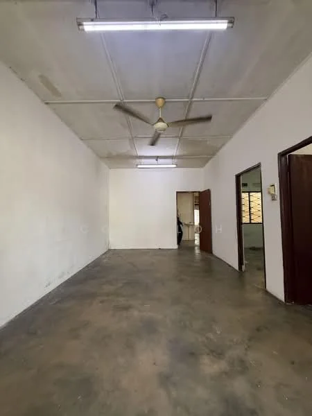 Room features: white painted walls, concrete flooring, exposed ceiling, ceiling fan, light fixtures, doorway leading to another room, window openings, neutral color scheme; style: minimalist.
