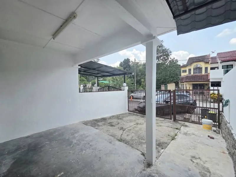 Exterior type: linked terrace house; features: concrete flooring, white painted walls, metal roof, gated entrance, manicured lawn, surrounded by greenery, car parking space; style: modern.