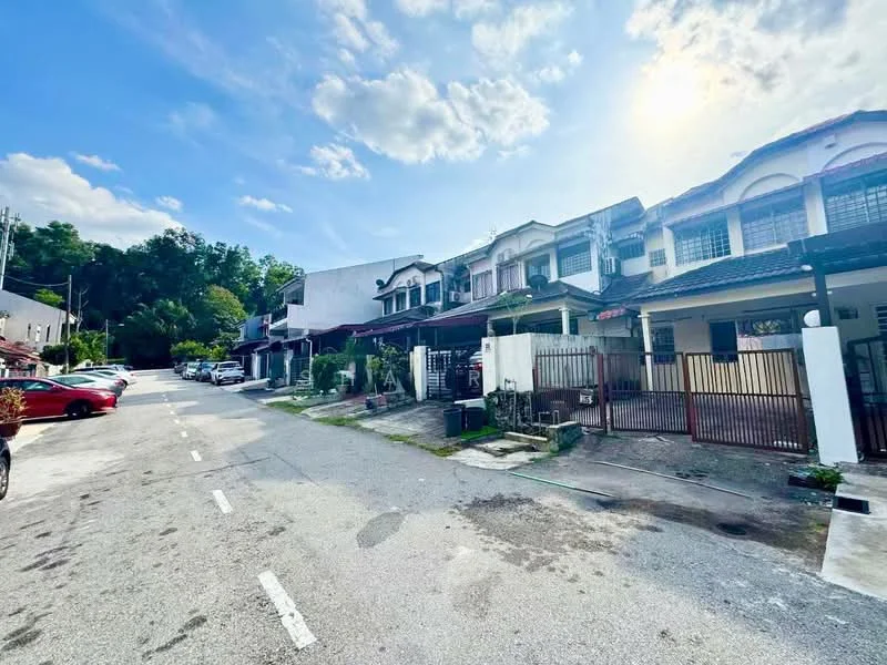 Exterior type: linked terrace house; features: two-storey houses, driveway with interlocking pavers, manicured front gardens, white painted facade, gated entry, surrounded by greenery, street view, clear blue sky, sunlight casting shadows; style: modern.
