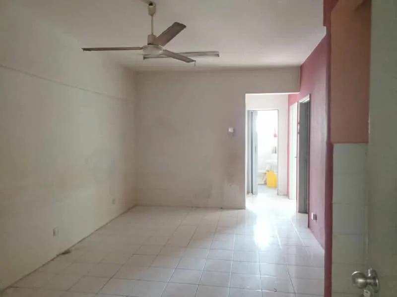 Living features: white painted walls, tile flooring, 5-blade ceiling fan, doorway leading to another room, neutral color scheme, no visible furniture, light source from doorway, empty space. Room features: doorway leading to bathroom, yellow bucket visible in background.