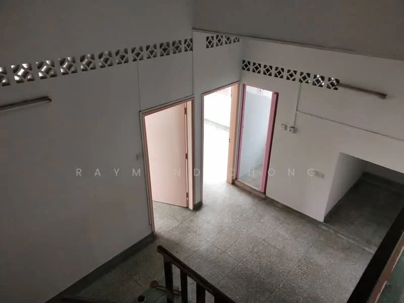 Room features: grey tiled flooring, white painted walls, two doors leading to outdoor space, decorative ventilation blocks, ceiling lights, staircase railing, open space layout; style: minimalist.