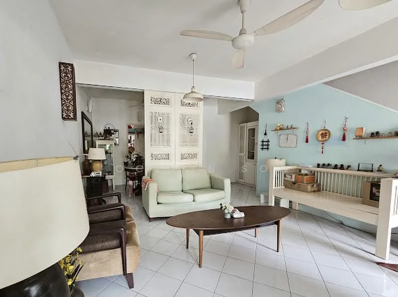 Living features: light green fabric sofa, wooden coffee table, 2 brown leather armchairs, ceiling fan, white walls, tile flooring, decorative wall with wooden panels, wall-mounted shelves, decorative items on shelves, natural light from windows, open layout to adjacent room; style: contemporary.