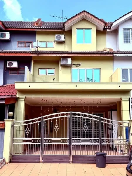 Exterior type: linked terrace house; features: two-storey building, yellow painted facade, red tiled roof, metal gate with decorative design, multiple air conditioning units visible, balcony on the second floor, large windows on the upper floor, paved driveway, outdoor lighting fixtures, front porch area; style: modern.
