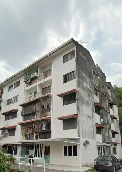 Exterior type: low-rise apartment block; features: white painted facade, balconies with metal railings, multiple air conditioning units visible, ground floor entrance, 3-storey building, some balconies have plants, visible parking area, weathered exterior surfaces; style: traditional.