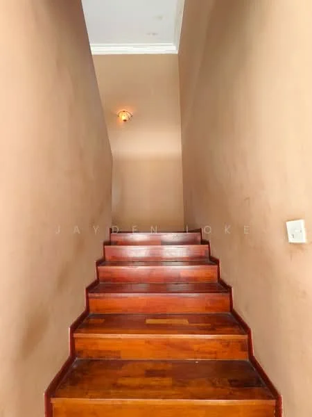 Room features: wooden staircase, brown painted walls, ceiling light fixture, crown moulding.