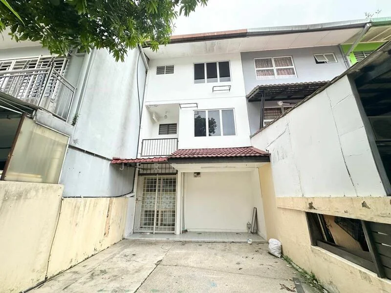 Exterior type: linked terrace house; features: two-storey building, red tiled roof, white painted facade, balcony on upper floor, concrete driveway, fenced area, manicured landscaping, windows with metal grilles; style: modern.